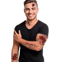 FIESTAS GUIRCA Tatueringstabell med sår och maskar><noscript><img width=