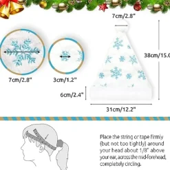 Vuxen vit tomteluva med julplyschhatt och blå snöflinga> Huvudbonader
